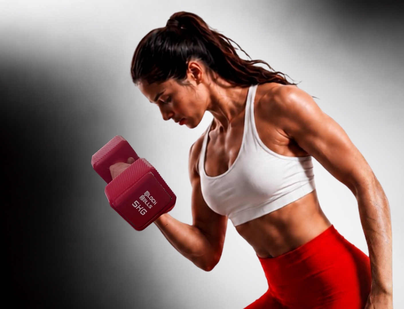 Block Bells training — woman curling 5KG Block Bell